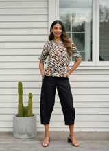 Load image into Gallery viewer, Ruffles &amp; Scoop Hem Top
